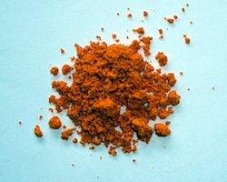A brown powder on a blue background